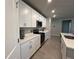 Well-equipped kitchen featuring stainless steel appliances, ample counter space, and sleek white cabinetry at 1249 Oak Valley Dr, Auburndale, FL 33823