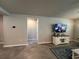 Comfortable living room featuring neutral paint, tile floors, and a decorative rug to tie the space together at 1249 Oak Valley Dr, Auburndale, FL 33823