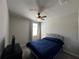 Comfortable bedroom with soft carpet, a plush bed, and a window providing natural light at 1249 Oak Valley Dr, Auburndale, FL 33823
