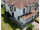 Aerial view of the rear of a home featuring a patio with seating and manicured landscaping at 14049 Millington St, Orlando, FL 32832