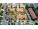 A high-angle view showing several upscale townhomes with well-manicured lawns and tree-lined streets at 14049 Millington St, Orlando, FL 32832