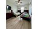 Bedroom featuring two twin beds, a dresser, and wood floors at 14049 Millington St, Orlando, FL 32832