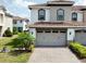 Charming home featuring a tile roof, two-car garage, and nicely landscaped front yard at 14049 Millington St, Orlando, FL 32832