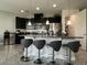 Modern kitchen featuring granite countertops, stainless steel appliances, and an island with bar seating at 14049 Millington St, Orlando, FL 32832
