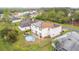 An aerial view of a home with solar panels, a backyard, and an above ground pool at 147 Pompei Dr, Kissimmee, FL 34758
