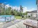 A fenced backyard with above ground pool and outdoor furniture at 147 Pompei Dr, Kissimmee, FL 34758