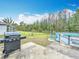 A backyard with lush green space, grill, and an above ground pool at 147 Pompei Dr, Kissimmee, FL 34758