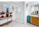 Bright bathroom featuring a walk-in shower with glass door and double vanity at 147 Pompei Dr, Kissimmee, FL 34758