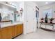 Bright bathroom featuring a walk-in shower, vanity with storage, and decor at 147 Pompei Dr, Kissimmee, FL 34758