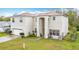 Two-story home featuring an attached two-car garage and well manicured lawn at 147 Pompei Dr, Kissimmee, FL 34758