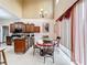 Bright kitchen features a breakfast nook with a table and chairs set next to a window at 147 Pompei Dr, Kissimmee, FL 34758