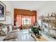 Living room featuring elegant furniture, tiled floors, and decorative accents at 147 Pompei Dr, Kissimmee, FL 34758