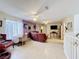 Open-concept living area with ceiling fans, ceramic tile, and neutral tones, ideal for relaxation at 147 Pompei Dr, Kissimmee, FL 34758