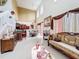 Bright living room with high ceilings, tile flooring, and ornate furnishings at 147 Pompei Dr, Kissimmee, FL 34758