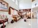 Ornate living room with high ceilings, elegant sofas, decorative wallpaper, and decor at 147 Pompei Dr, Kissimmee, FL 34758