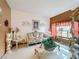 A spacious living room with elegant furniture and decorative accents at 147 Pompei Dr, Kissimmee, FL 34758