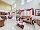 Spacious living room with tile flooring, high ceilings, and natural light at 147 Pompei Dr, Kissimmee, FL 34758