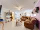 Cozy upstairs living room with comfortable seating and neutral decor at 147 Pompei Dr, Kissimmee, FL 34758