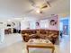 Living space features tile flooring, a ceiling fan, and a comfortable sectional couch at 147 Pompei Dr, Kissimmee, FL 34758