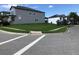 View of the corner lot featuring lush, green grass and showcasing the home's well-maintained landscaping at 15007 Night Heron Dr, Winter Garden, FL 34787
