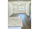 Open-concept living area highlighted by new floors, a bright window, and modern ceiling fan at 1539 Roselawn Sw St, Winter Haven, FL 33880
