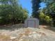 Close-up view of a storage shed in the backyard, providing secure outdoor storage options at 1539 Roselawn Sw St, Winter Haven, FL 33880