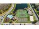 Aerial view of community amenities, including a pool, tennis courts, basketball court, and sand volleyball court at 2200 San Vittorino Cir # 105, Kissimmee, FL 34741