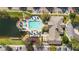 Aerial view of community pool, playground, and clubhouse, showcasing the community's recreational facilities at 2200 San Vittorino Cir # 105, Kissimmee, FL 34741