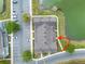 Aerial view of the community with parking, landscaping, and pond views at 2200 San Vittorino Cir # 105, Kissimmee, FL 34741