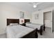 Bedroom with twin beds, ceiling fan, and a closet at 2200 San Vittorino Cir # 105, Kissimmee, FL 34741