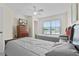 Bedroom with twin beds, a TV, ceiling fan, closet, and a window with a neighborhood view at 2200 San Vittorino Cir # 105, Kissimmee, FL 34741