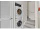 Stacked washer and dryer unit in the upstairs laundry area of the home at 2200 San Vittorino Cir # 105, Kissimmee, FL 34741