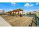 Charming wooden pier overlooking a serene pond and fountain in a residential neighborhood at 2200 San Vittorino Cir # 105, Kissimmee, FL 34741