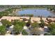 Aerial view showcases townhomes in a community with lake views, a serene and attractive setting at 2340 Palm Tree Dr, Kissimmee, FL 34759