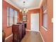 Dining area with unique hutch with dark wood furniture under a chandelier at 2340 Palm Tree Dr, Kissimmee, FL 34759