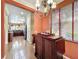 Dining area showcasing built-in hutch, hardwood floors, and bright, light-filled room at 2340 Palm Tree Dr, Kissimmee, FL 34759