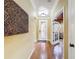 Inviting entryway with hardwood floors, decorative lighting, and an open view into the living space at 2340 Palm Tree Dr, Kissimmee, FL 34759