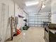 Spacious garage with a clean, epoxy-coated floor and organized shelving system at 2340 Palm Tree Dr, Kissimmee, FL 34759