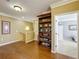 Hallway with a decorative shelf display, wood floors and doorway views at 2340 Palm Tree Dr, Kissimmee, FL 34759