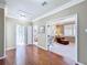 Hallway with hardwood floors, leading to a bathroom, bedroom and living room at 2340 Palm Tree Dr, Kissimmee, FL 34759