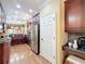 Spacious kitchen with stainless steel refrigerator, granite countertops, and dark wood cabinets at 2340 Palm Tree Dr, Kissimmee, FL 34759