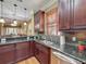 Kitchen featuring dark granite countertops, stainless steel appliances, and a breakfast bar at 2340 Palm Tree Dr, Kissimmee, FL 34759
