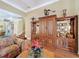 Spacious living room featuring custom built-in shelving and easy access to the staircase at 2340 Palm Tree Dr, Kissimmee, FL 34759