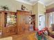 Elegant living room showcasing custom-built wooden shelving and hardwood floors, perfect for displaying décor at 2340 Palm Tree Dr, Kissimmee, FL 34759