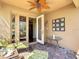Beautiful outdoor space with fan, comfortable seating, and access to living area at 2340 Palm Tree Dr, Kissimmee, FL 34759