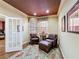 A cozy sitting area with leather chairs, ambient lighting, and a decorative ceiling at 2340 Palm Tree Dr, Kissimmee, FL 34759