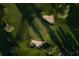 Aerial view of the golf course with lush green grass and a sand trap at 2566 Conway Gardens Rd, Orlando, FL 32806