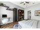 Cozy bedroom with built-in desk, floating shelves, and hardwood floors at 2566 Conway Gardens Rd, Orlando, FL 32806