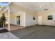 Spacious carport with convenient access to the home, featuring a paved driveway and ample parking space at 2566 Conway Gardens Rd, Orlando, FL 32806