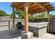 Outdoor kitchen featuring a sink, prep area and grill at 2566 Conway Gardens Rd, Orlando, FL 32806